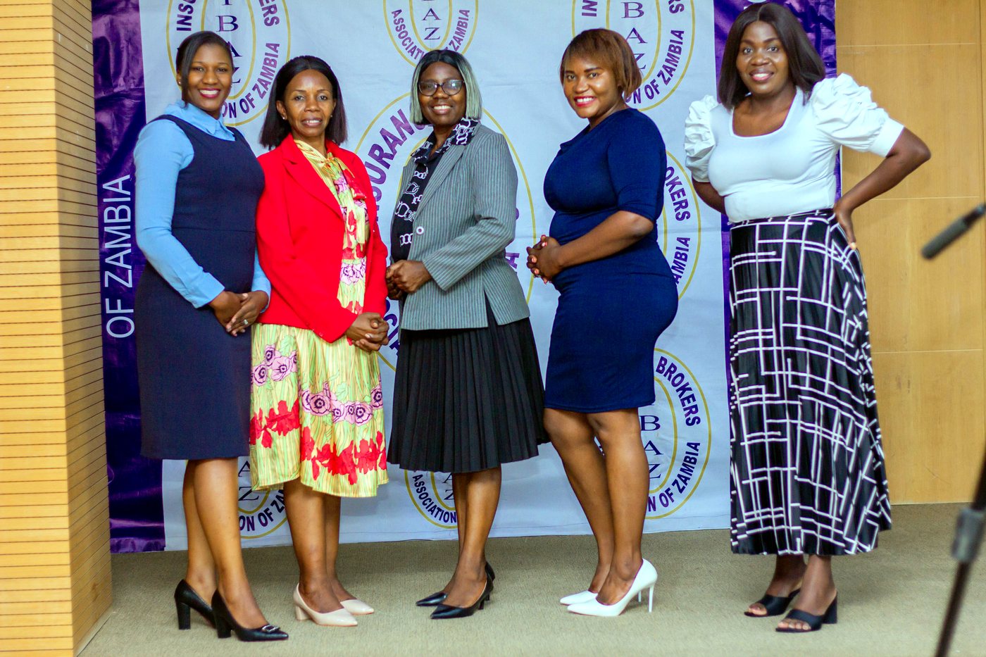 IBAZ delegates in front of the association backdrop